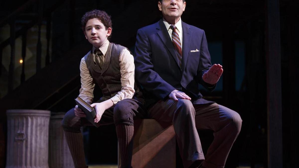 Matthew Schechter (left) and Tony Shalhoub (both playing Moss Hart) in a scene from Lincoln Center Theater's production of “Act One,” a play written and directed by James Lapine from the autobiography by Moss Hart, at the Vivian Beaumont Theater (150 West 65 Street).