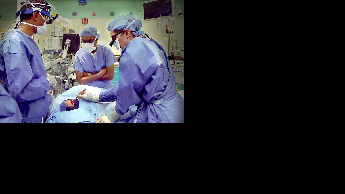 
Lilly being prepared for surgery to remove her oral tumor at The Children’s Hospital of Philadelphia in the PBS documentary “Twice Born.”
