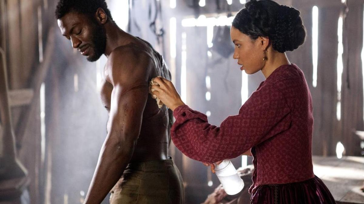 Aldis Hodge (left) and Jurnee Smollett-Bell in WGN’s new drama series “Underground,” executive produced by John Legend.