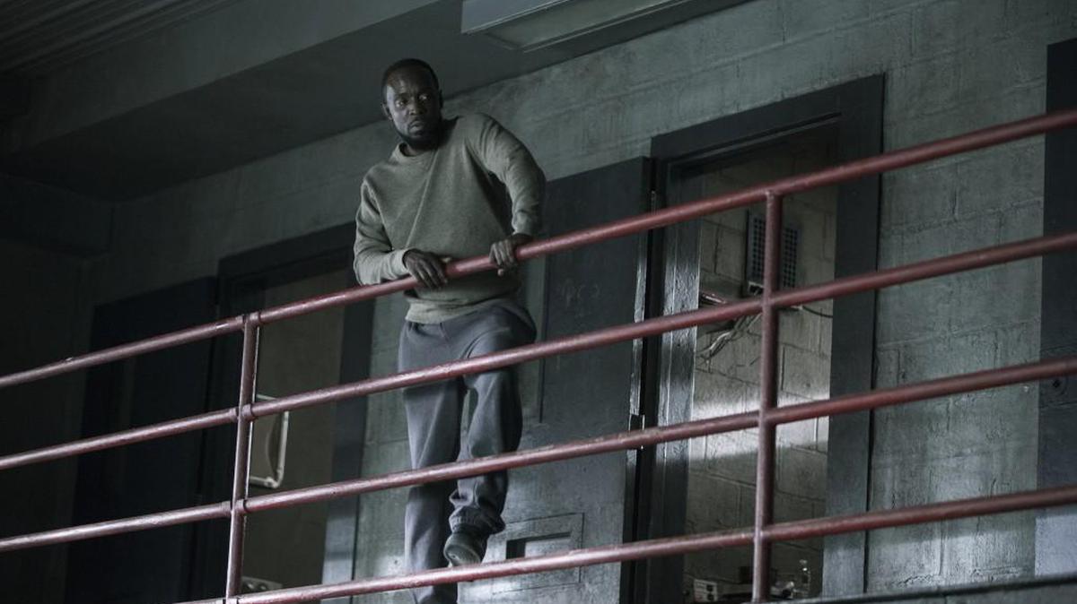 Naz realizes his survival rests in the hands of one particular inmate, played by Michael Kenneth Williams (pictured here).