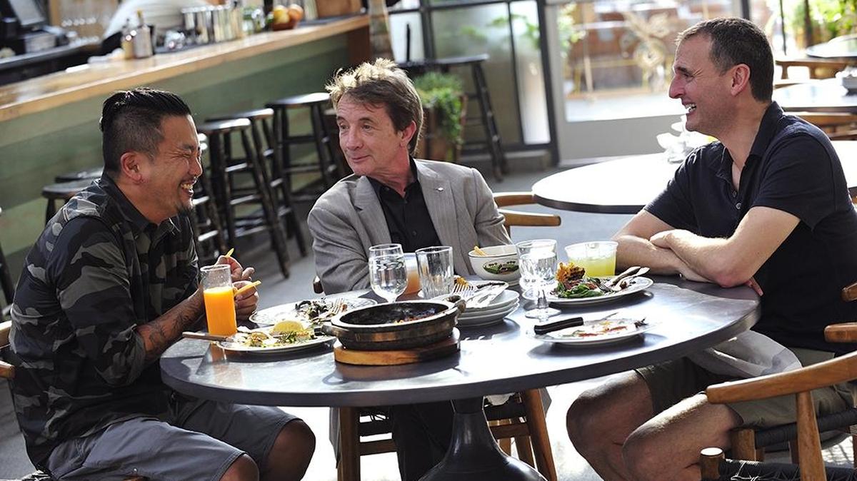 Phil Rosenthal (right) enjoys some of LA’s best Korean food with chef Roy Choi (left) and actor Martin Short (center).