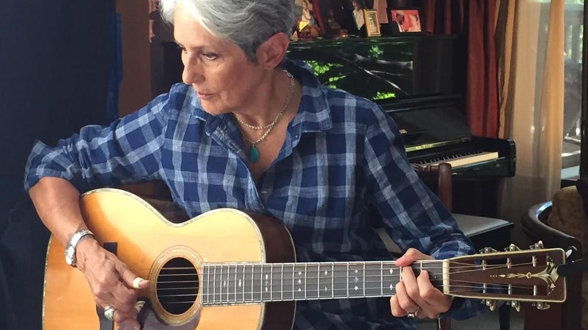 Joan Baez plays her Martin guitar.