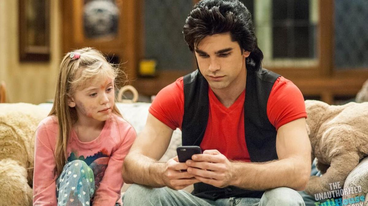 
(L to R): Dakota Guppy (Jodie Sweetin/Stephanie Tanner) and and Justin Gaston (John Stamos/Jesse Katsopolis) in the Lifetime movie “The Unauthorized Full House Story.”
