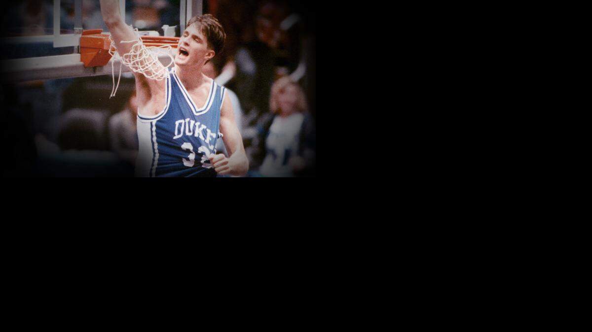 
Duke’s Christian Laettner cuts down the nets after an NCAA playoff game against the University of California in 1990. 
