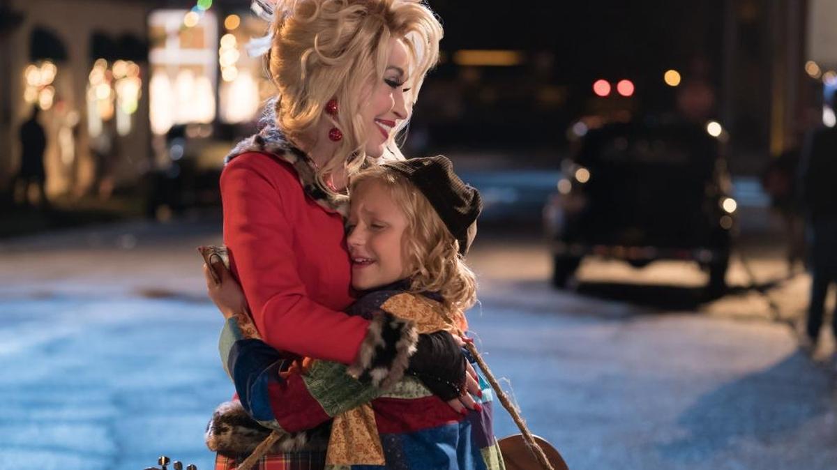 Dolly Parton, left, as The Painted Lady and Alyvia Alyn Lind as Dolly Parton in “Dolly Parton's Christmas Of Many Colors: Circle Of Love” on NBC.
