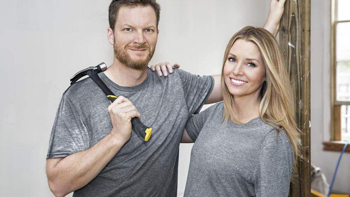 Former NASCAR star Dale Earnhardt Jr. and his interior designer wife Amy pose for a picture during filming in Key West for their DIY Network series. The Earnhardts have a sale pending on the refurbished home, according to the home’s listing on Realtor.com.
