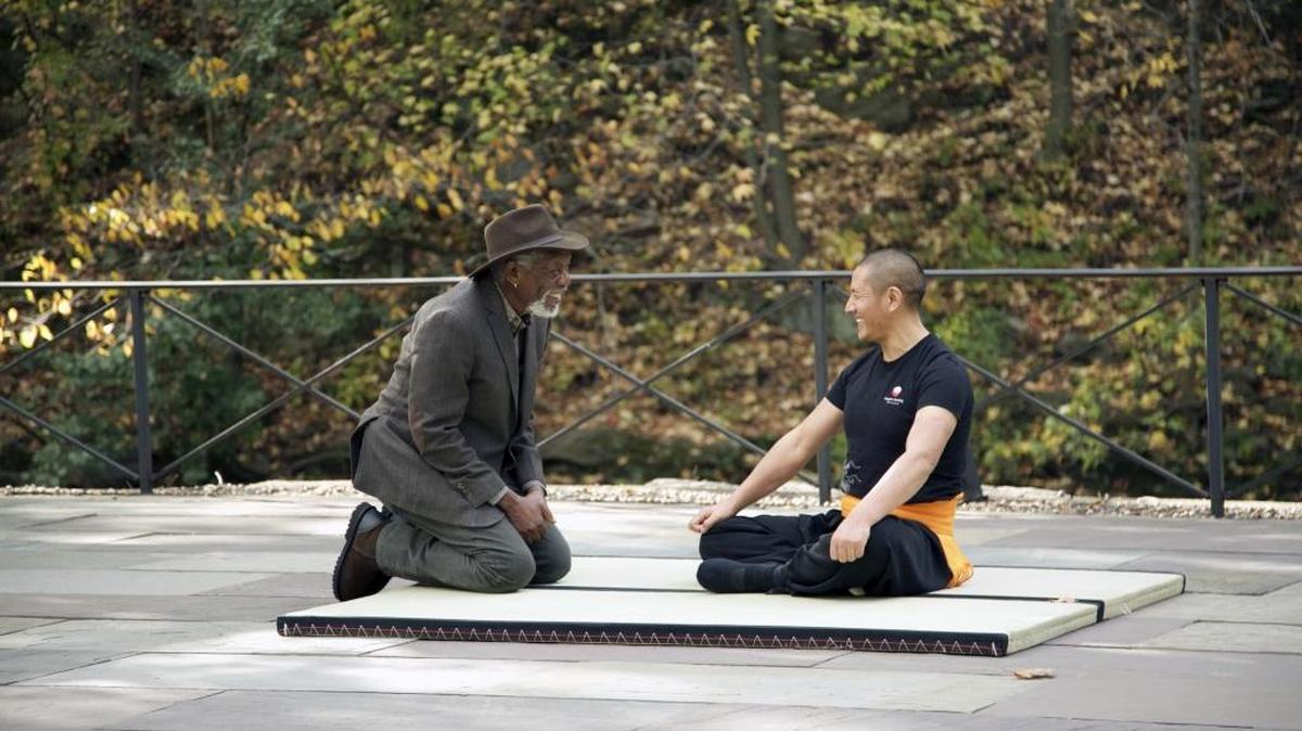 Morgan Freeman, left, interviews Rinpoche Tulku Lobsang, Tibetan Buddhist Tantryana Master, after his brief warm up in the back patio of Minus 5 Icebar on “The Story of God” on the National Geographic Channel.