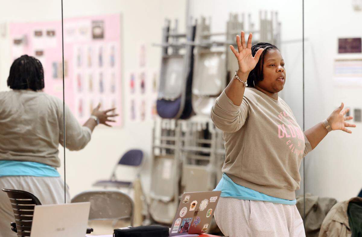 Lakeetha Blakeney, who wrote the play “Bessie Coleman: Fearless and Free," directs her play during rehearsal Monday, Oct. 27 at ImaginOn in Charlotte.