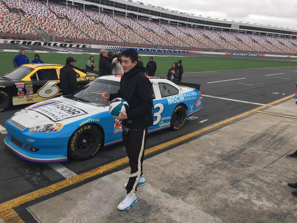 Chinese professional basketball player Ding Yanyuhang takes in the scene during the group’s tour of Charlotte Motor Speedway in Concord on Saturday.