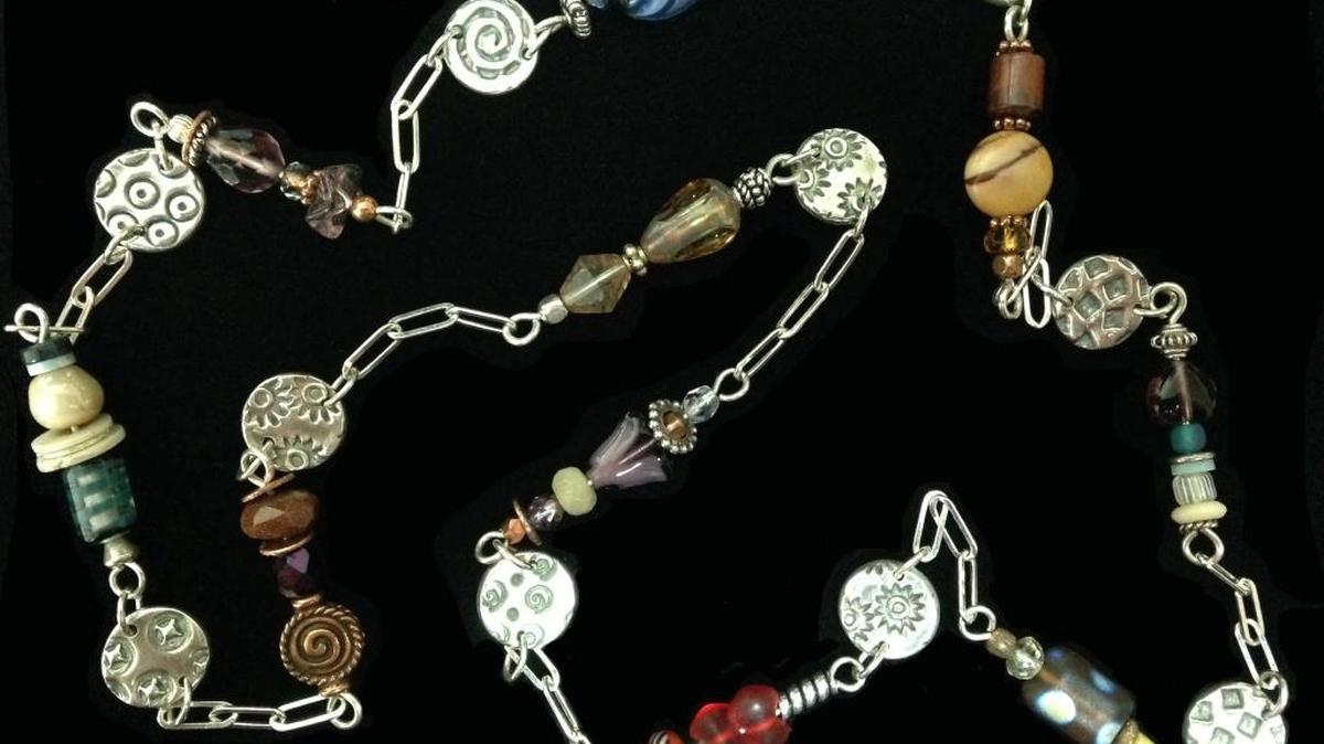 Reversible patterned disc necklace with bead modules of fine silver, semi-precious stones and vintage beads by Pam Whittfeld.