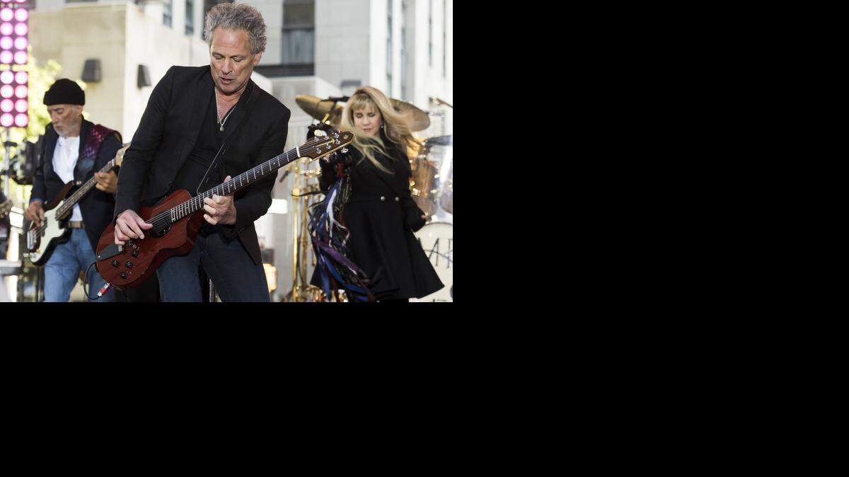 
John McVie, left, Lindsey Buckingham and Stevie Nicks from Fleetwood Mac perform Saturday at Time Warner Cable Arena in Charlotte.
