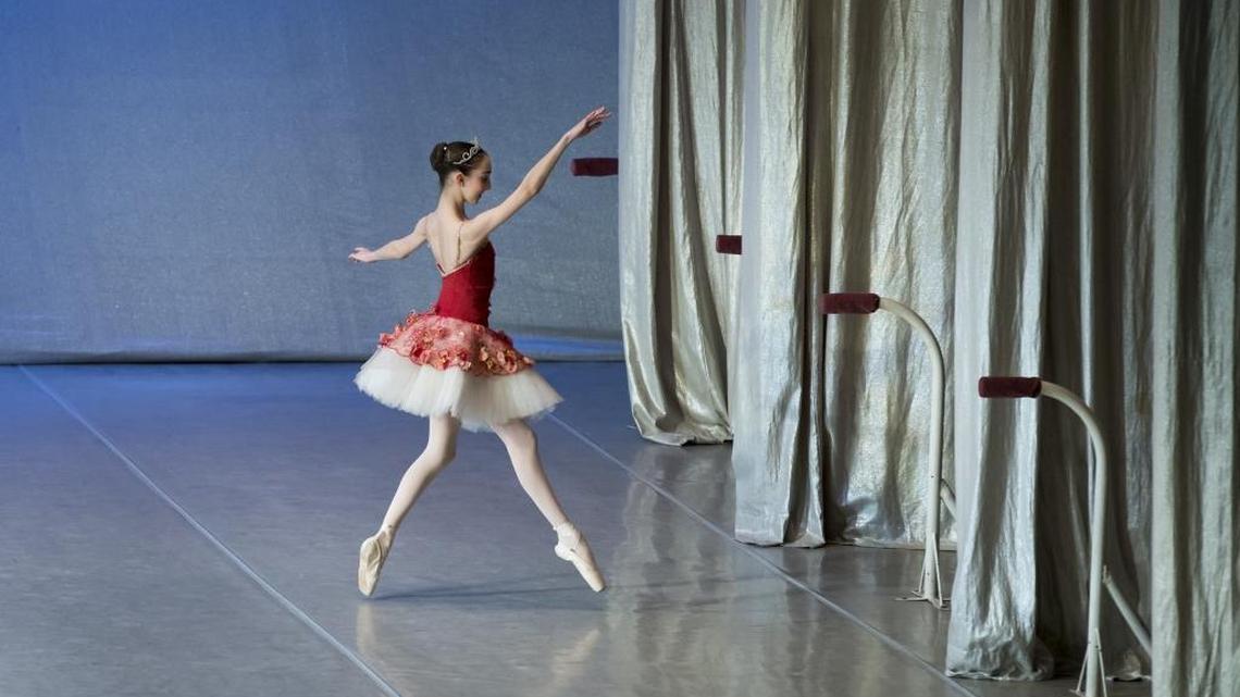 In this photo taken on Thursday, March 3, 2016, Harper Ortlieb, from Mount Hood, Oregon, leaves a scene after performing at the Bolshoi Ballet Academy in Moscow, Russia. Among the dozen 15-year-old girls in lavender leotards in Tatyana Galtseva’s class at the Bolshoi Ballet Academy, one is different. She is Harper Ortlieb, an American, who left her small town in Oregon to move to Moscow to follow her dream of becoming a prima ballerina.