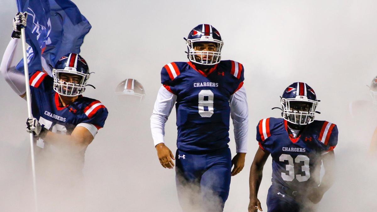 Providence Day quarterback Grantt Logan (8) leads his team onto the field to play Charlotte Christian in the Big South 4A championship game in Charlotte, N.C., Friday, Nov. 6, 2020. (Nell Redmond photo)