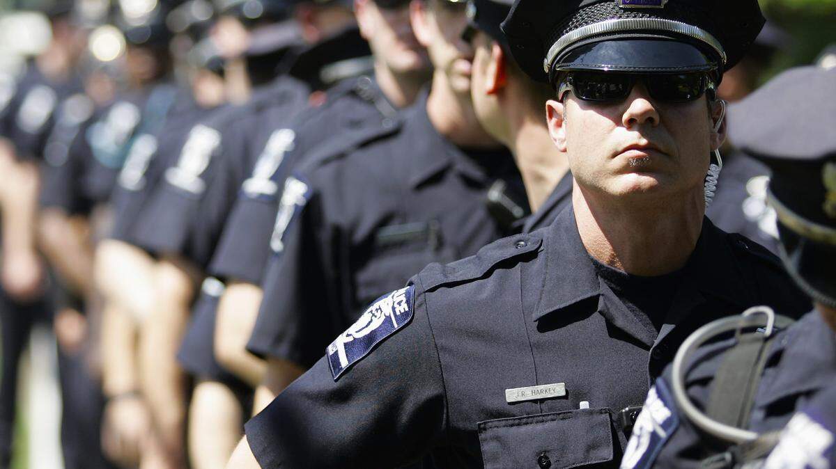 Charlotte would need a lot of security for the 2020 Republican National Convention, like these CMPD officers containing protesters before the DNC in 2012.