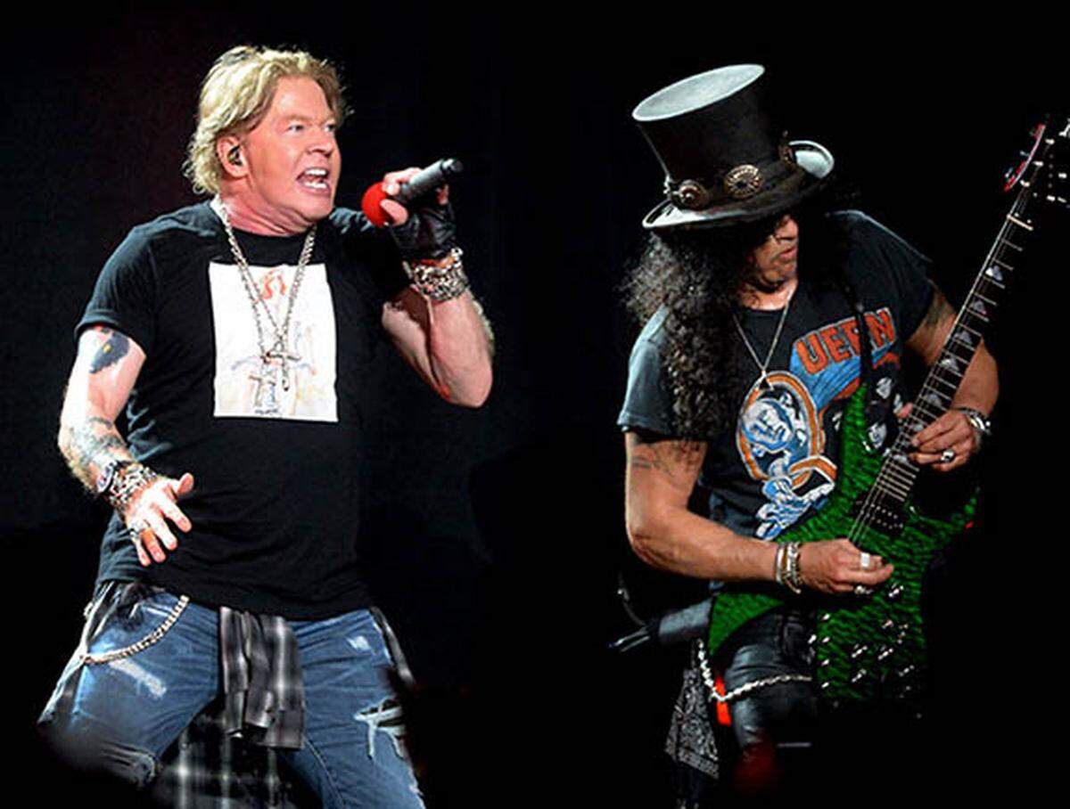 Axl Rose, left and guitarist Slash, right, of Guns N’ Roses perform during the “Not in This Lifetime Tour at Spectrum Center in Charlotte, NC on Wednesday, September 25, 2019.