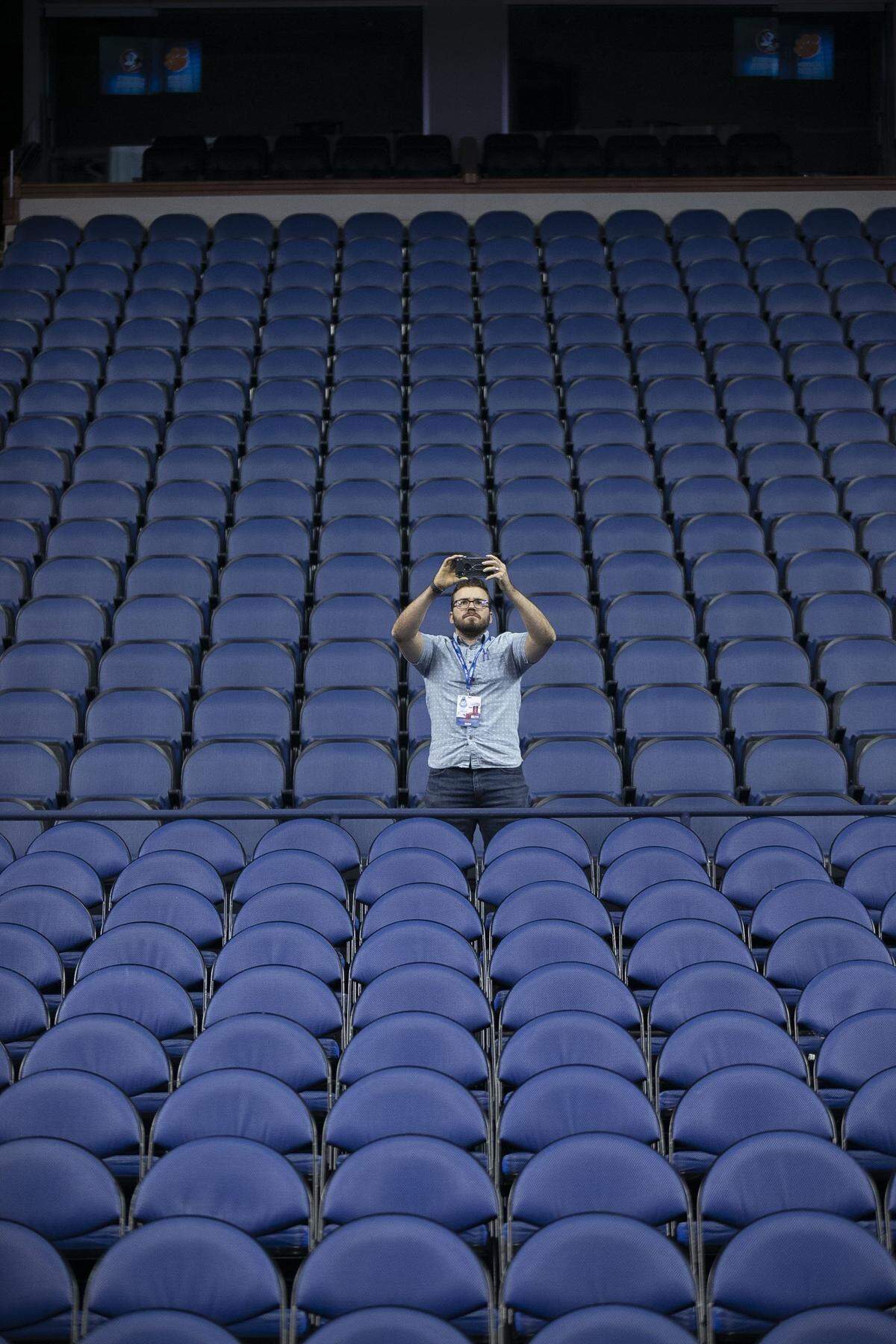 Reporter Ethan Joyce from the Winston-Salem Journal documents the cancellation of the ACC Men’s Basketball tournament due to the COVID-19 virus on Thursday, March 12, 2020 at the Greensboro Coliseum in Greensboro, N.C.