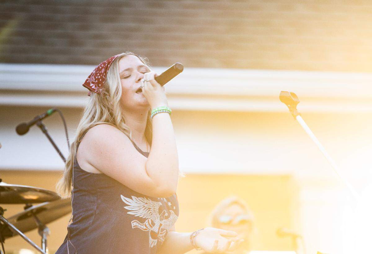 Bailey Griggs performs with her band at The Shore Club at Tega Cay in Tega Cay, S.C., on Friday, July 12, 2024. Bailey recently found out that she will not be able to attend her senior year of high school at Cramerton Christian Academy in Gastonia because of her live music performances at venues that serve alcohol.