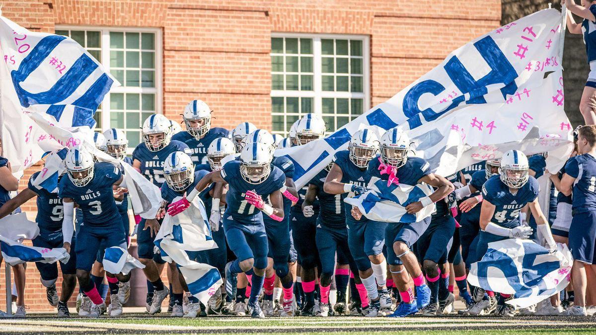 The Hickory Ridge Bulls take the field at the High School Football Kickoff Showcase.