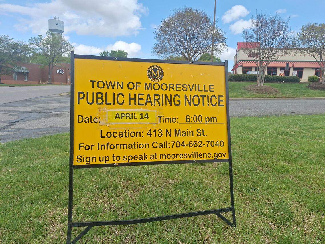 Starbucks plans to open a Lake Norman drive-thru location right across the road from its smaller coffee chain rival, Dunkin’, formerly Dunkin’ Donuts. This sign announces the public hearing for a required watershed certificate for the planned location.