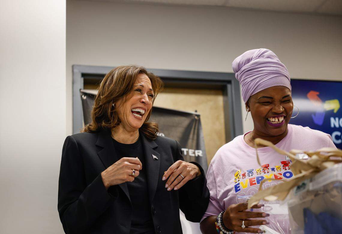 Vice President Kamala Harris laughs with Melissa Funderburk with NC Counts Coalition as they work together to assemble care packages with toiletries for those who were affected by Hurricane Helene in Charlotte, NC on Saturday, Oct. 5, 2024.