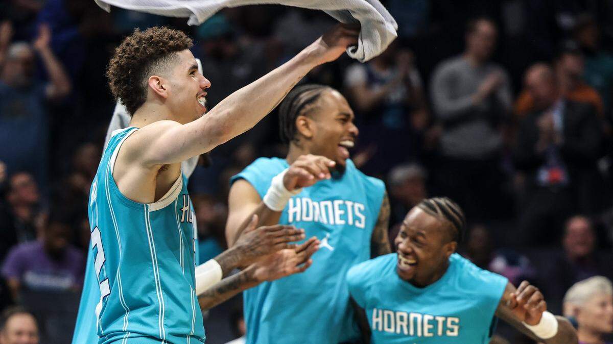 Charlotte Hornets bench celebrates against the Orlando Magic at the Spectrum Center in Charlotte, N.C., on Thursday, April 7, 2022.