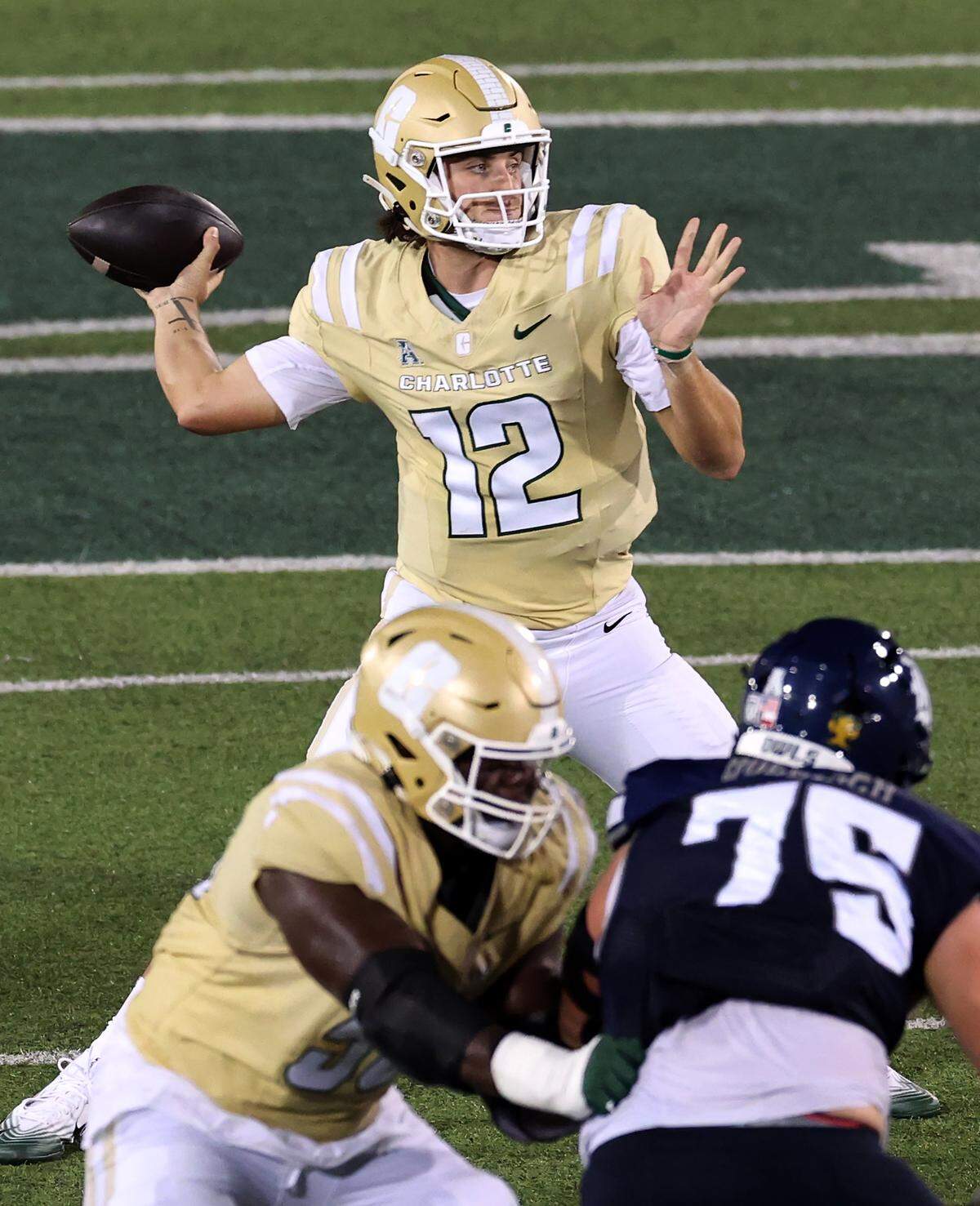 Charlotte 49ers quarterback Grayson Loftis drops back to pass during action against the Rice Owls on Thursday, September 18, 2025 at Jerry Richardson Stadium in Charlotte, NC. Loftis replaced starting quarterback Conner Harrell who was injured on a run.