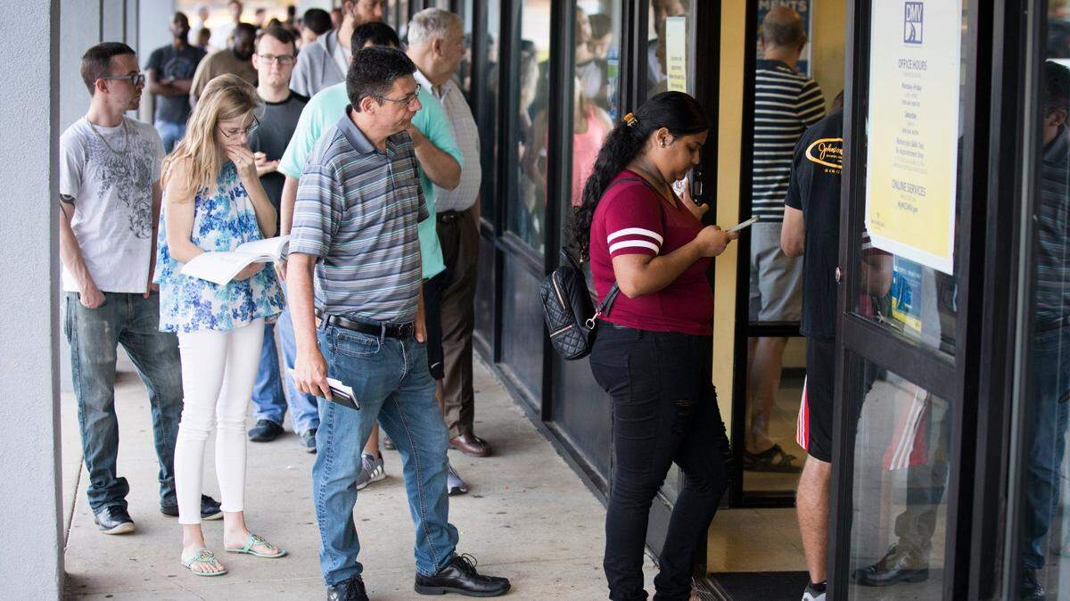 In this file photo, customers wait to get in to the Division of Motor Vehicles office in North Raleigh.