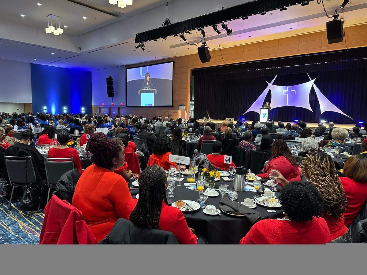 The sorority sisters from the Charlotte chapter of Delta Sigma Theta all wore red at the MLK breakfast hosted by the YMCA on Monday.