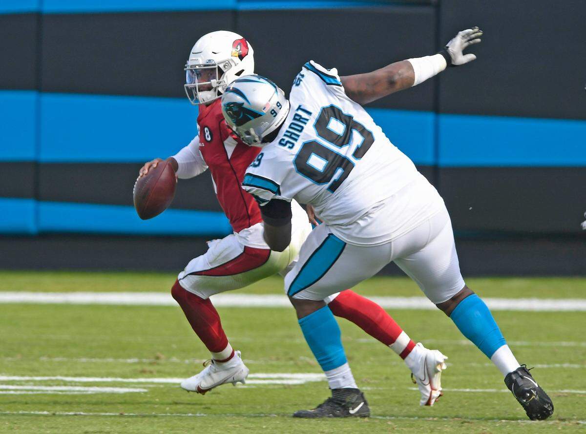 Arizona Cardinals quarterback Kyler Murray (1) tries to escape the reach of Carolina Panthers defensive tackle Kawann Short (99) during the second half at Bank of America Stadium in Charlotte, NC on Sunday, October 4, 2020. The Panthers won, 31-21