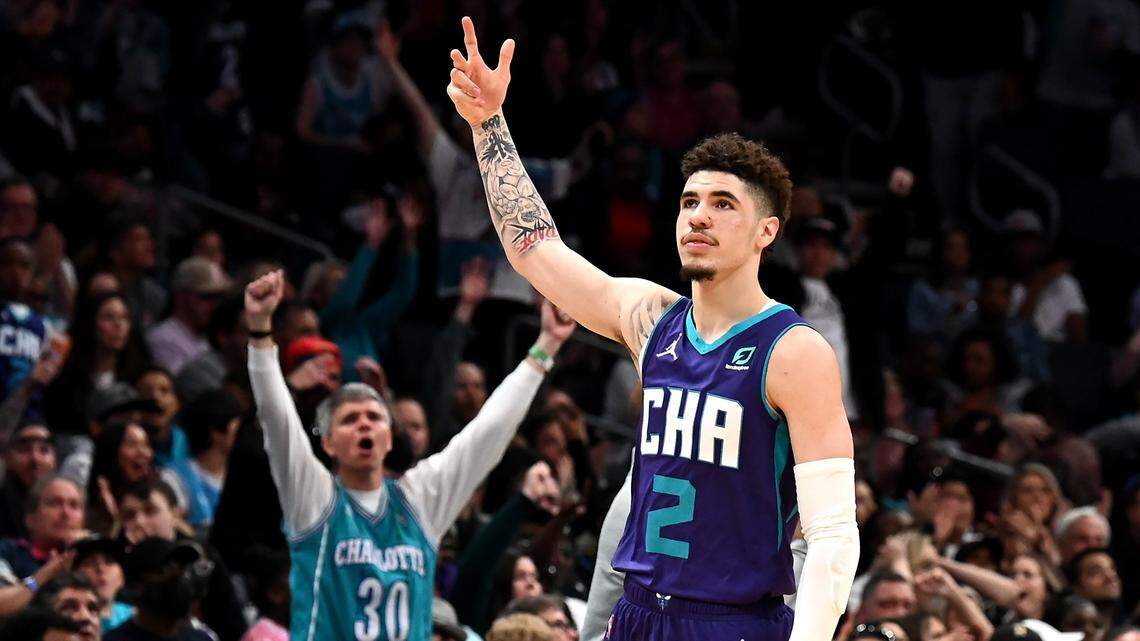 Charlotte Hornets guard LaMelo Ball raises is arm in celebration after scoring a three-pointer during second half action against the Washington Wizards at Spectrum Center in Charlotte, NC on Sunday, April 10, 2022. Ball scored 24 points in the game. The Hornets defeated the Wizards 124-108.