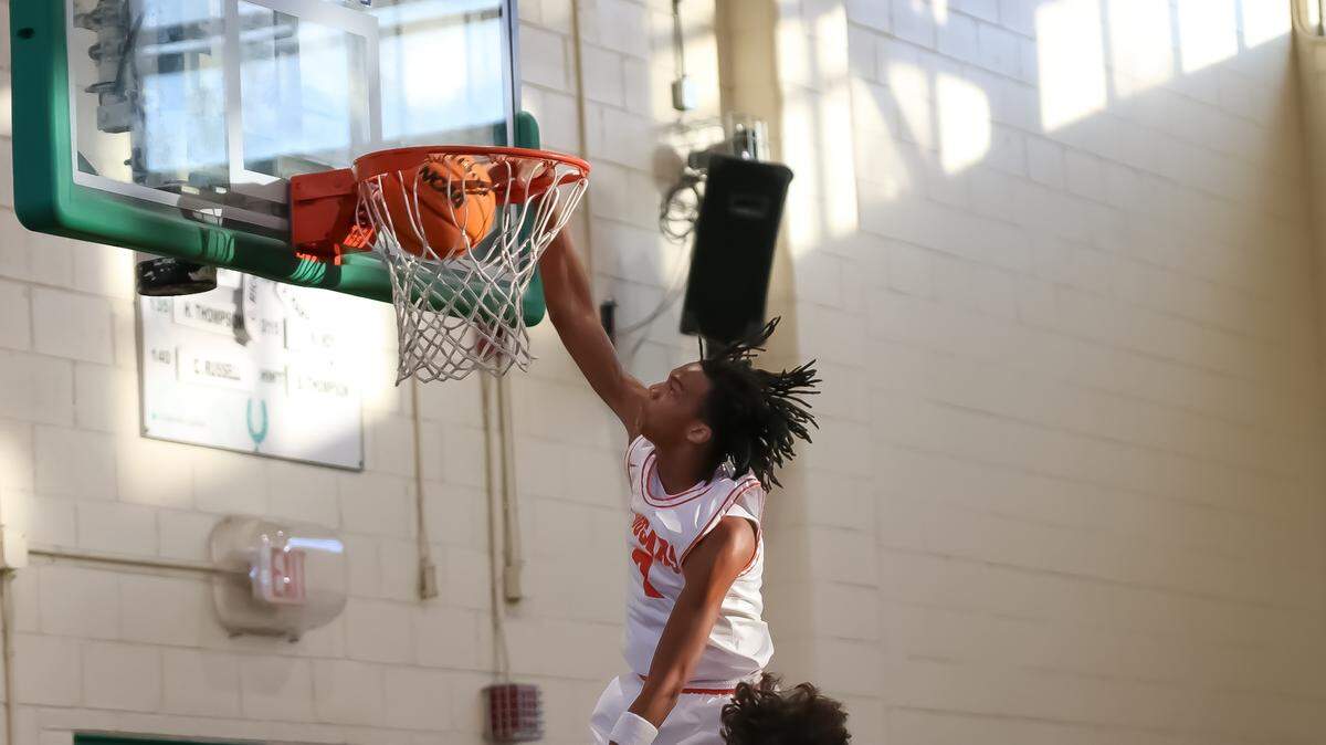 Chambers’ QJ Young dunks after getting a fast break against Wilmington New Hanover at the George Lynch Invitational at Myers Park high school on November 22nd, 2025