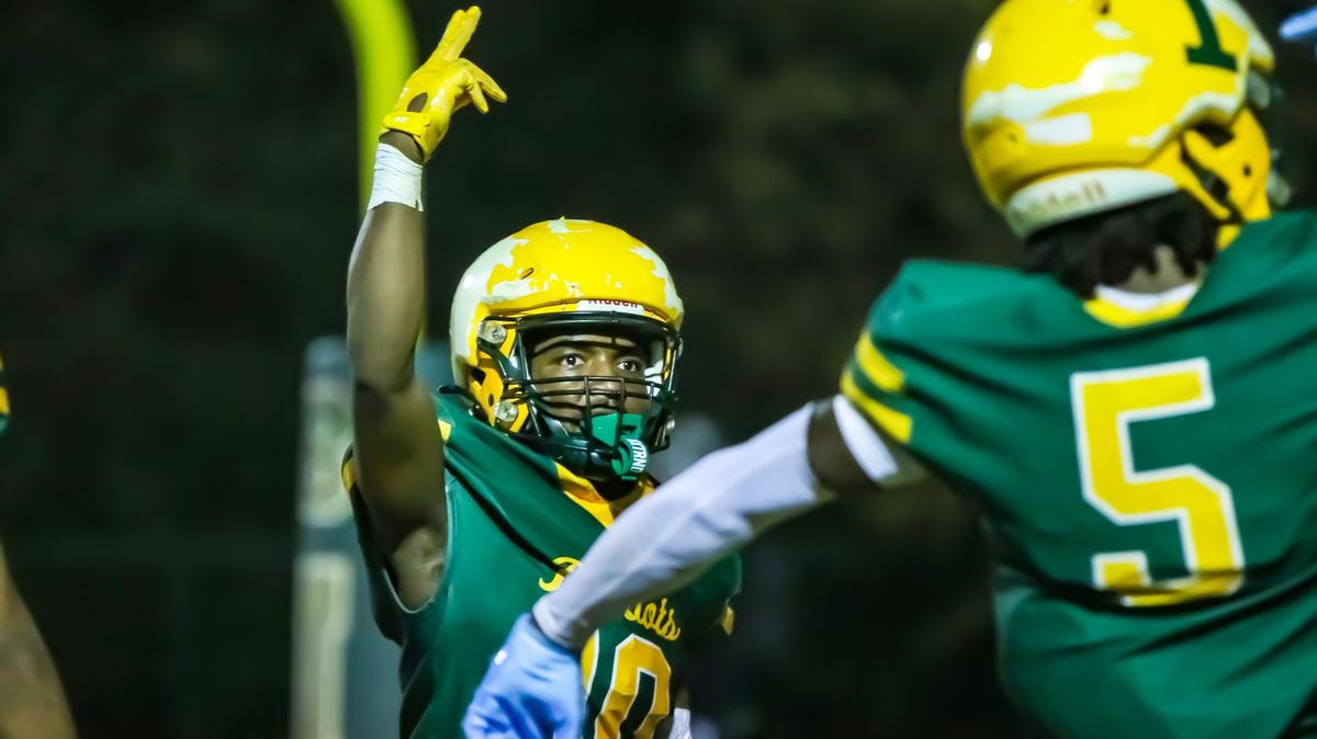 Travis Hill celebrates with teammates in the end zone as they pull ahead of Butler during the Butler-Independence game Friday, Nov. 1 at Independence High in Mint Hill, N.C.