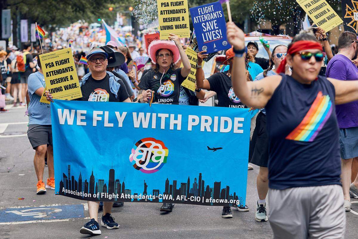The Association of Flight Attendants march during the 25th Charlotte Pride Parade in uptown Charlotte to massive fanfare on August 17, 2025.
