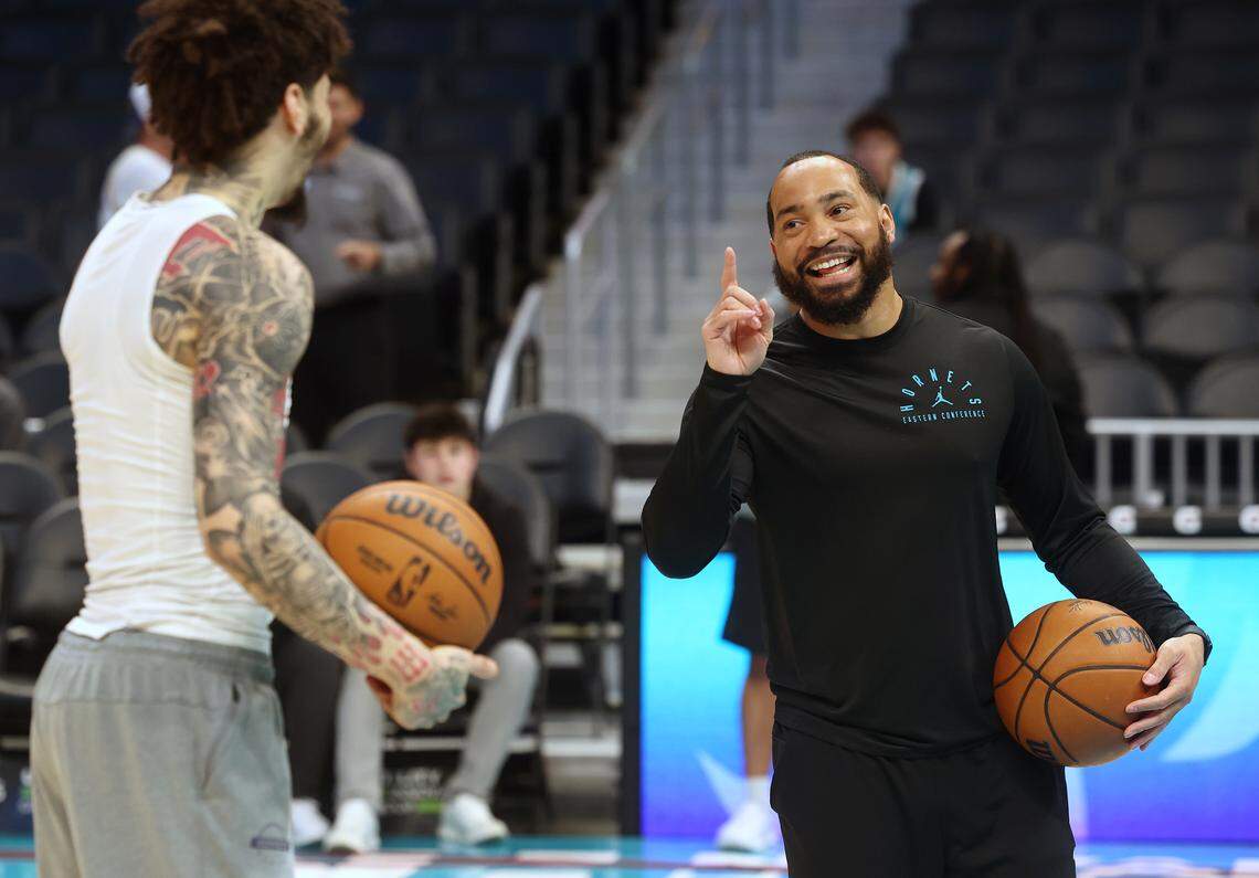Charlotte Hornets assistant coach Lamar Skeeter, right, jokes with guard LaMelo Ball prior to the team’s game against the Indiana Pacers at Spectrum Center in Charlotte, North Carolina, on Thursday, Jan. 8, 2026.