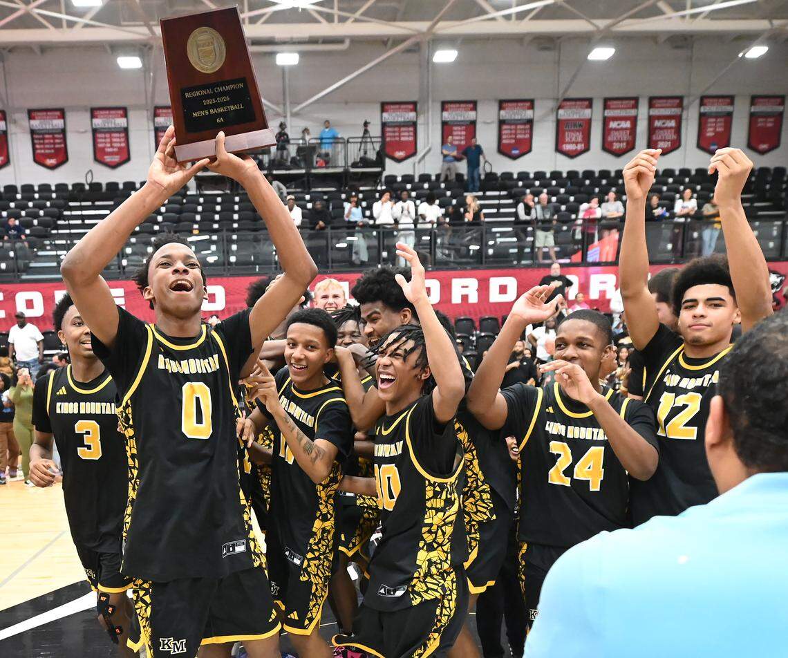 Members of the Kings Mountain boys basketball team celebrate their 68-61 victory over Charlotte Catholic in the NCHSAA 6A boy’s regional championship game on Wednesday, March 4, 2026 at Lenoir-Rhyne University in Hickory, NC. 