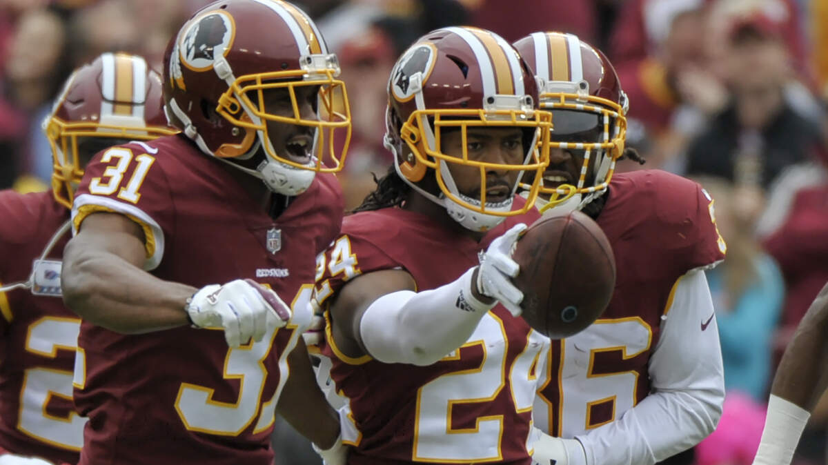 Washington cornerback Josh Norman (24) celebrates his interception during the first half of an NFL football game against the Carolina Panthers. Norman, a former Panthers corner, forced two of three total Panthers turnovers. His interception of quarterback Cam Newton was his first since 2016.