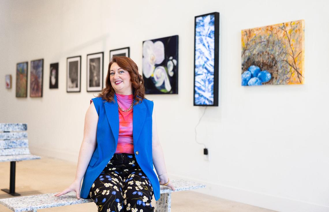 Charlotte Art League’s new executive director, Kate McAllister, sits Wednesday in the new gallery space hall at 4237 Raleigh St. in Charlotte.