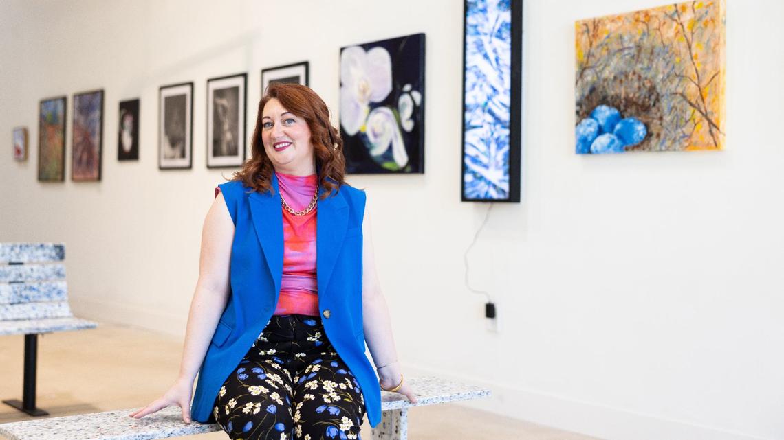 Charlotte Art League’s new executive director, Kate McAllister, sits in the new gallery space hall at 4237 Raleigh St. in Charlotte.