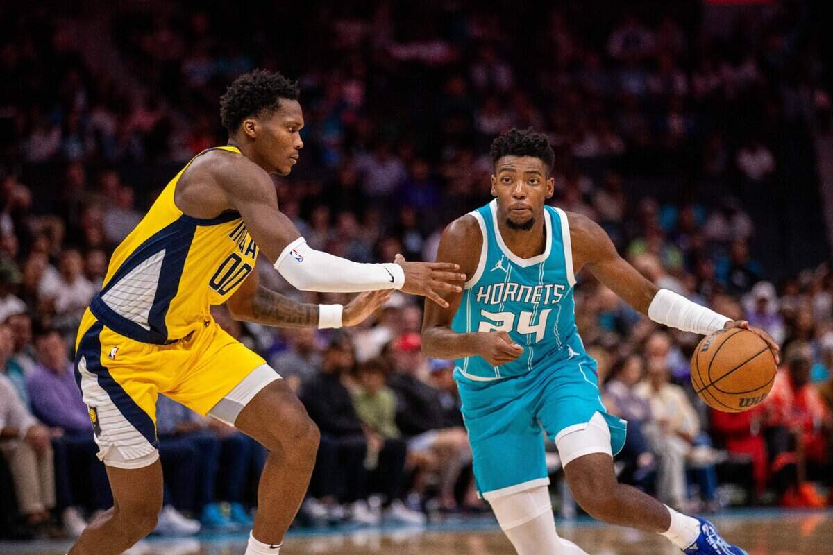Charlotte Hornets forward Brandon Miller (24) drives against Indiana Pacers guard Bennedict Mathurin (00) during the second quarter at Spectrum Center.