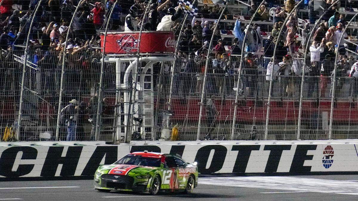 May 29, 2023; Concord, North Carolina, USA; NASCAR Cup Series driver Ryan Blaney (12) takes the checkered flag during the Coca-Cola 600 at Charlotte Motor Speedway.