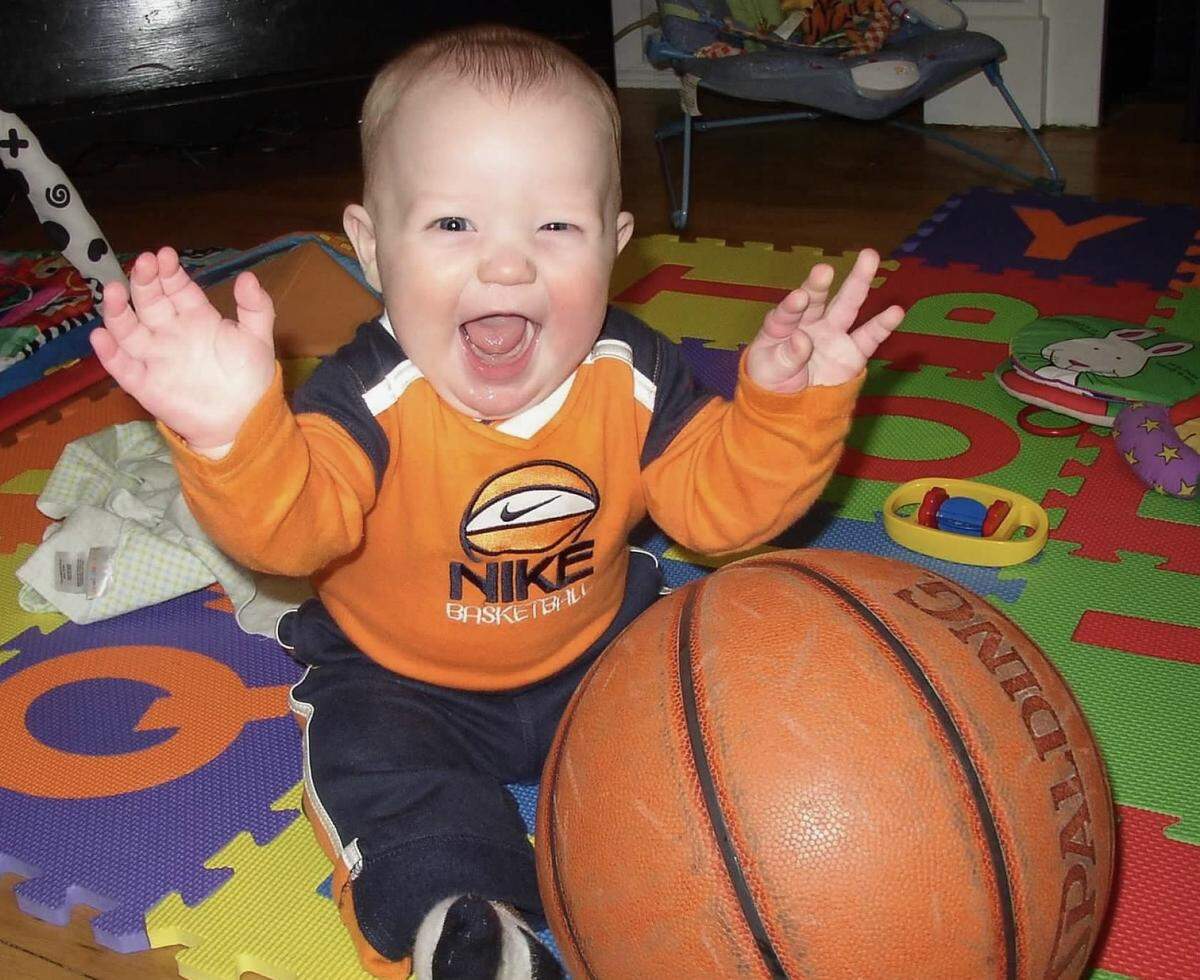 Since both of Kon Knueppel’s parents played basketball collegiately, he was encouraged to love the game early with mixed results. Here he is at age 1, with a full-sized basketball.