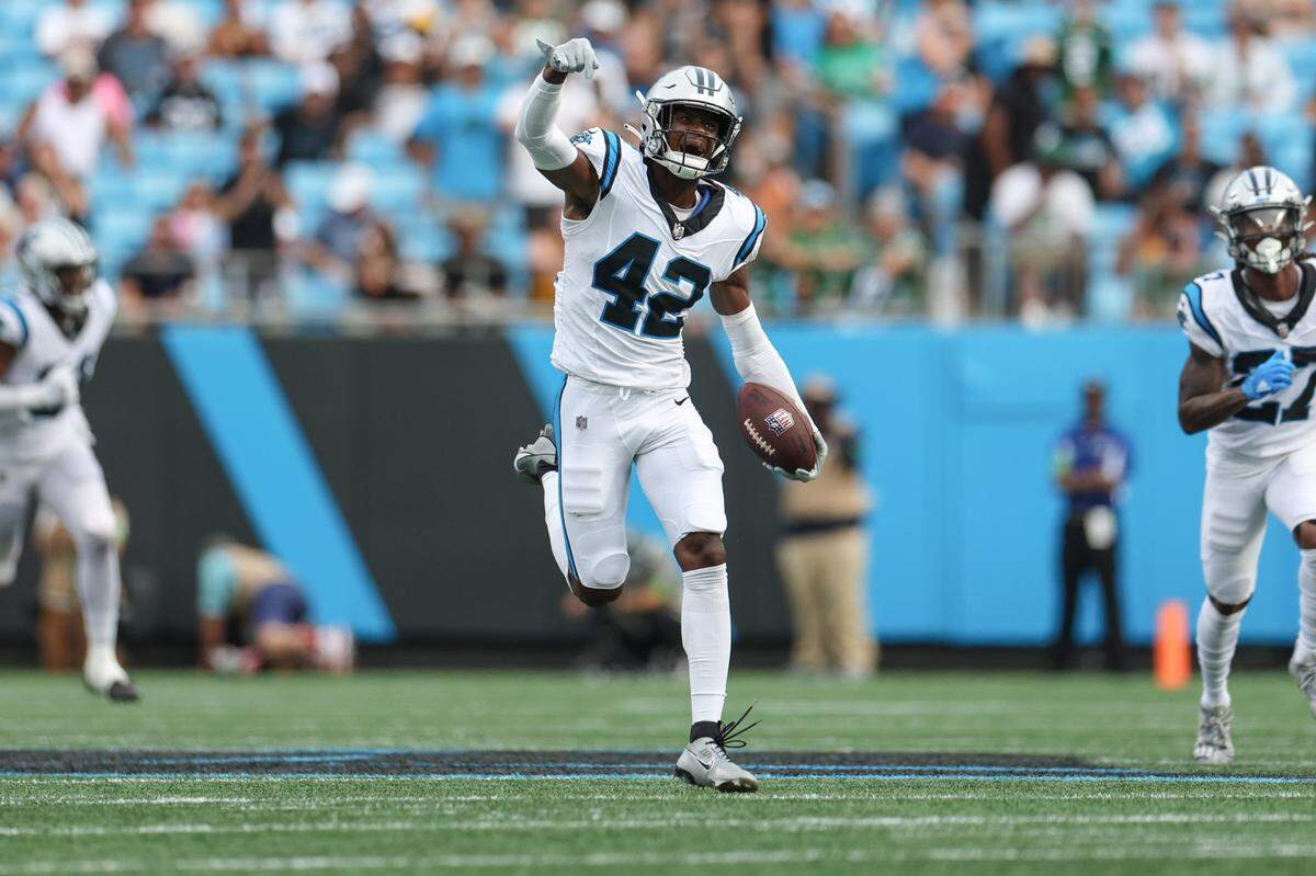 Panthers safety Sam Franklin, Jr. celebrates after intercepting a pass during the pre-season game against the Jets at Bank of America Stadium on Saturday, August 12, 2023 in Charlotte, NC.