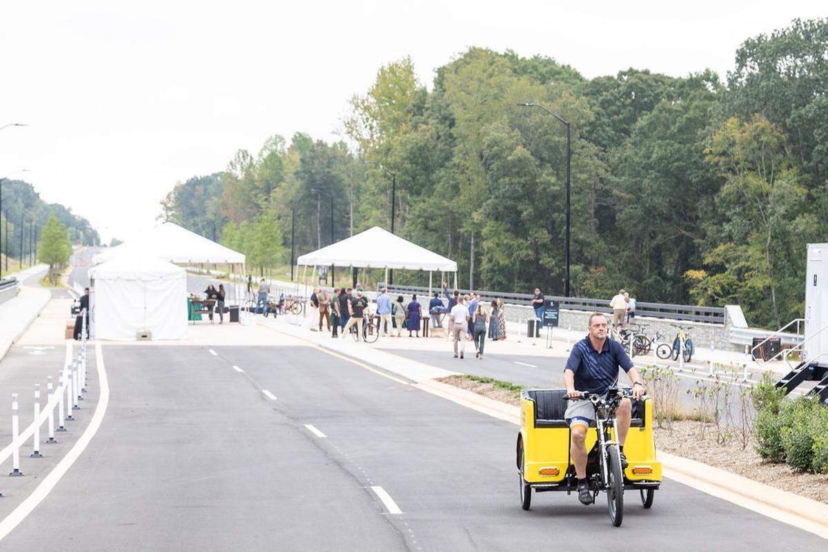 The West Boulevard expansion as part of the River District project features four lanes, a bike path and sidewalks.