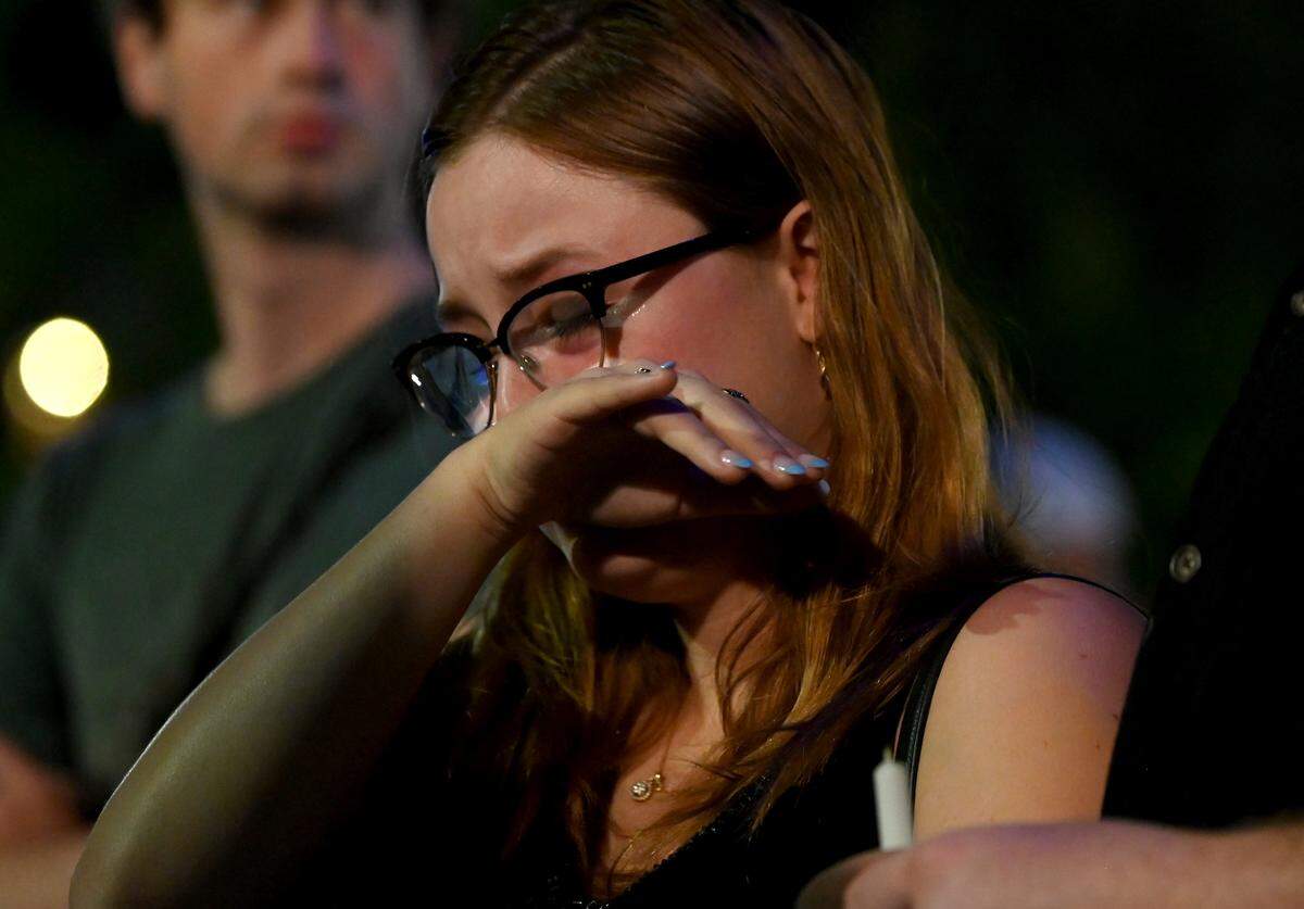 Autumn Walden wipes away tears during a memorial service for Iryna Zarutska on Monday in Charlotte.