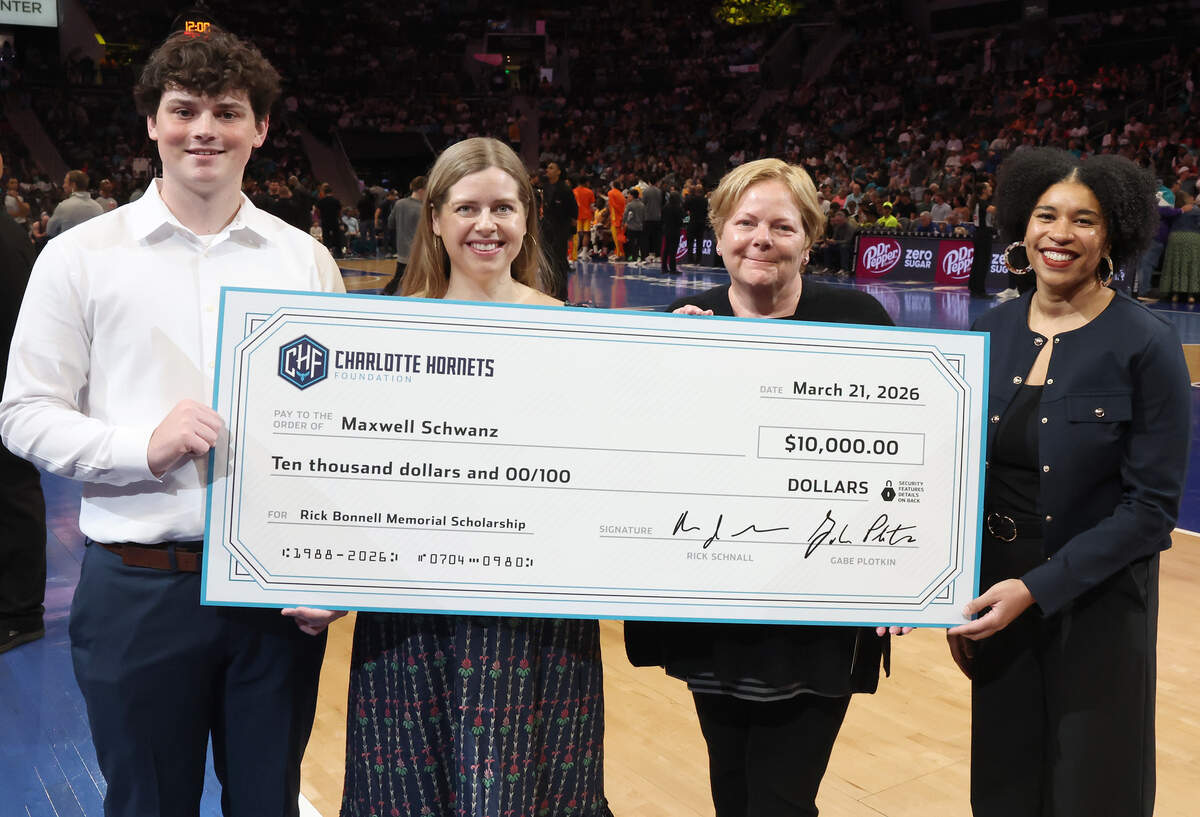 Maxwell Schwanz, left, is the recipient of the Rick Bonnell Memorial Scholarship award. Schwanz was presented the award during the first and second quarter break of the Charlotte Hornets game against the Memphis Grizzlies at Spectrum Center in Charlotte, NC on Saturday, March 21, 2026. (L-R) Maxwell Schwanz, Claire Bonnell, Lydia Craver and Charlotte Hornets Foundation director Whitney Tarver.