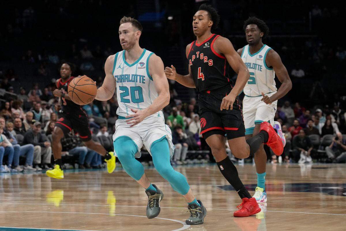 Charlotte Hornets forward Gordon Hayward (20) moves the ball ahead of Toronto Raptors forward Scottie Barnes (4) during the first quarter at the Spectrum Center.