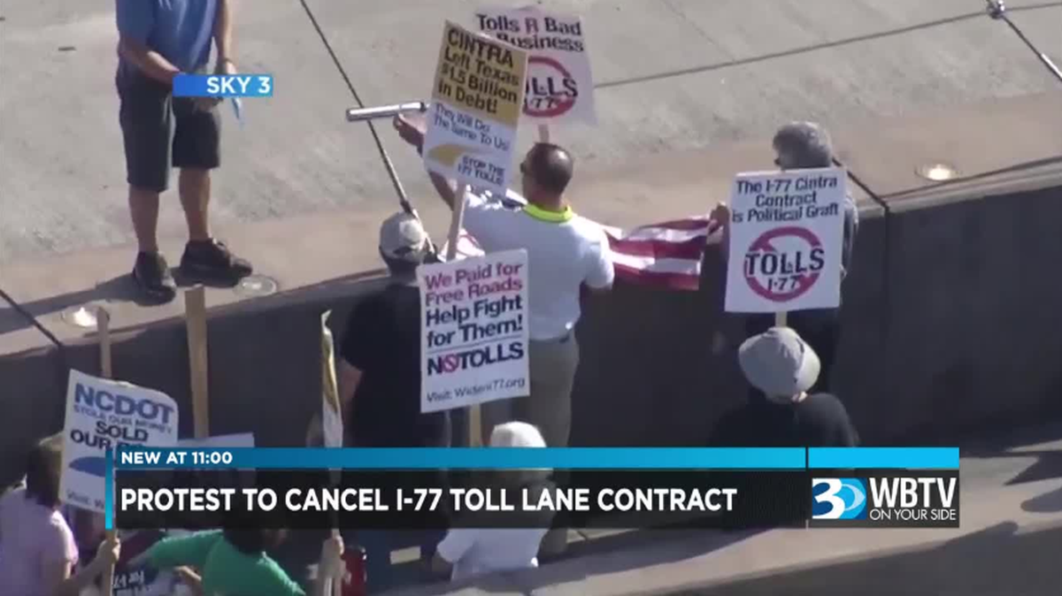 Protestors gather to cancel I-77 toll lane contract in north Mecklenburg County.