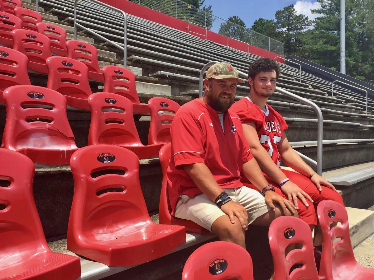 Belmont South Point coach Adam Hodges (left) says offensive lineman Larry Dowdy is one of the best players he’s coached in 15 years at the school. Dowdy has committed to Georgia Tech.