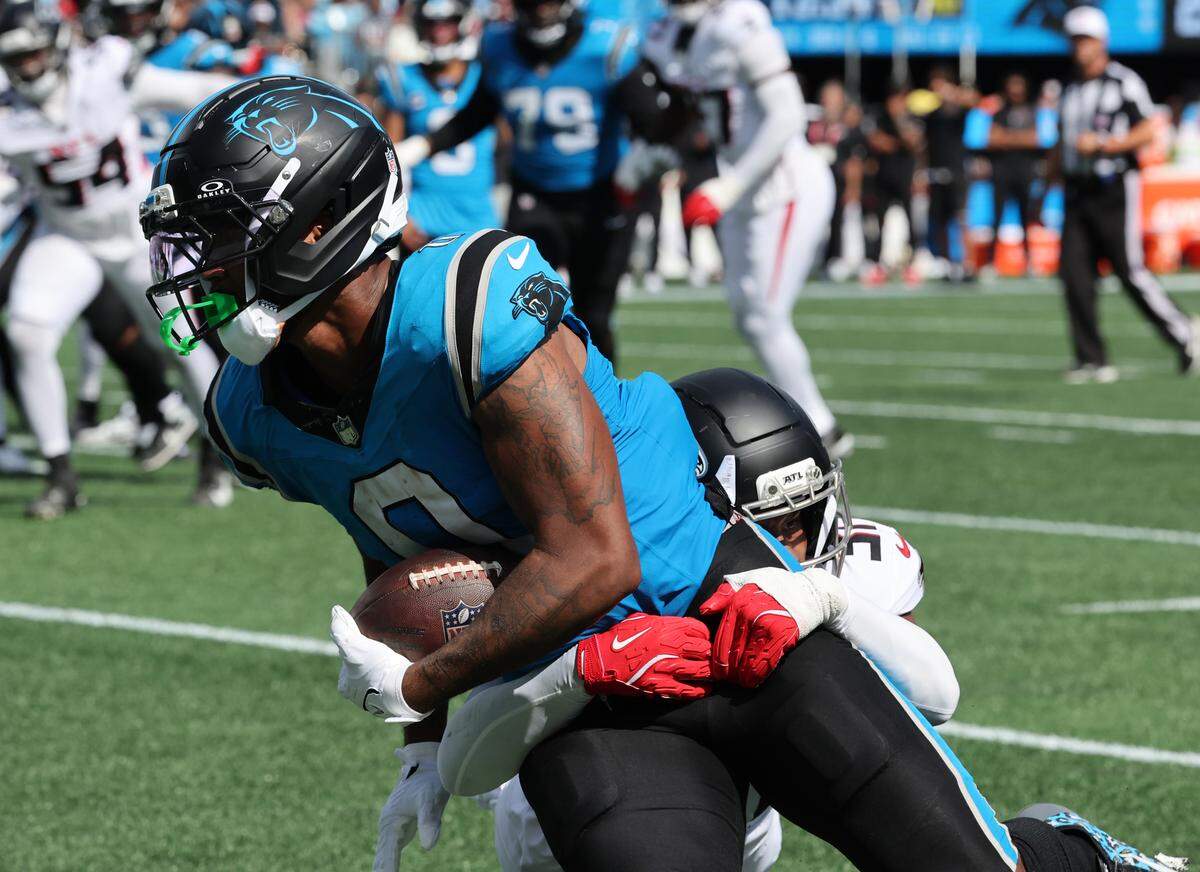 Carolina Panthers' Ja'Tavion Sanders is brought down near the endzone at the Bank of America Stadium in Charlotte on Sunday, September 21, 2025.