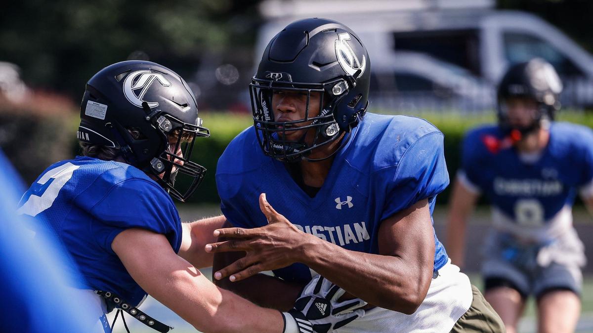 Charlotte Christian defensive end Elijah Littlejohn, right, pushes through an offensive block during football practice on Wednesday, August 22, 2024.